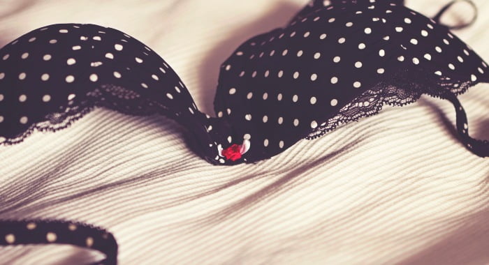 Sleeping without a bra will help you breath better. And don't worry about sagging breasts, it is not correlated.